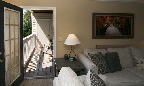 A balcony off of the living area in a sober living home at The 4th Dimension